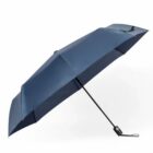 Closed blue umbrella against a white background.
