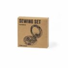 Brown box labeled Sewing Set with sketched image of sewing items inside.