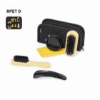 Grooming kit with brushes, comb, mirror, cloth, and black case.