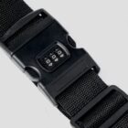 Black strap with a black combination lock buckle on a gray background.
