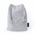 Grey drawstring pouch with a fabric tag on a white background.