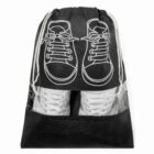 Black drawstring bag with sneaker graphic, showing white shoes through a transparent section.
