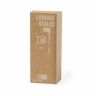 Cardboard box labeled Luggage Scales with a simple line drawing of a scale on it.