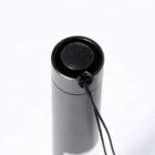 Top view of a black flashlight with a wrist strap on a white background.