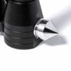 Close-up of a black and silver metal spike, attached to a cylindrical object, on a white background.