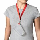 Person wearing a gray shirt and a cup holder lanyard around their neck.
