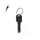 Key-shaped black pocket knife with a silver ring on a white background.