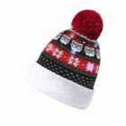 Knitted winter hat with Santa faces, red pom-pom, and glowing snowflake patterns.