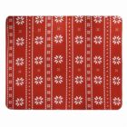 Red mat with white snowflake and dot patterns in vertical stripes.