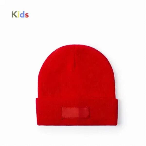 Bright red knit beanie hat for kids on a white background.