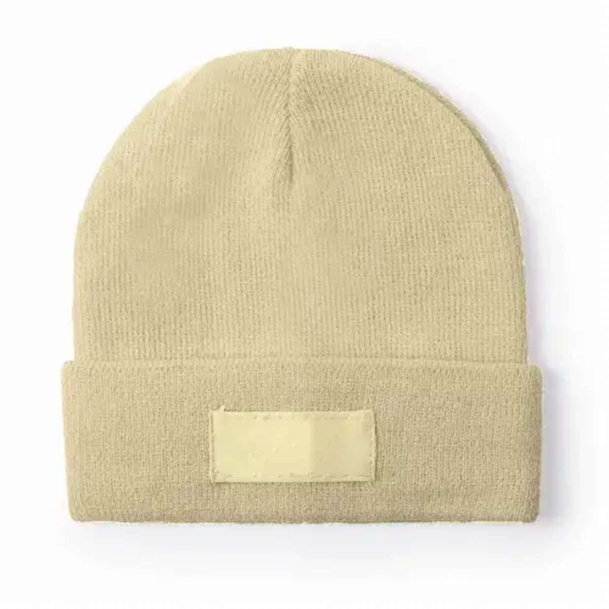 Beige knit beanie with a folded cuff and a blank rectangular patch on the front.
