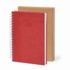 Red 2025 spiral notebook in front of a brown box, both standing upright.