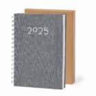 Gray 2025 spiral planner with elastic band, standing in front of a brown box.