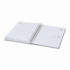 An open spiral-bound planner displaying blank pages for multiple days.