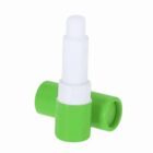 A green and white nasal inhaler with its cap removed.