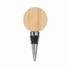 A wine bottle stopper with a round wooden top and a metal pointed end.