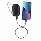 A phone charging with a power bank using a black USB cable.