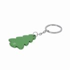 A green metal keychain shaped like a pine tree attached to a silver key ring.