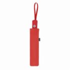A closed red umbrella in a matching sleeve with a red wrist strap.