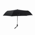 Black compact umbrella with a straight handle and wrist strap, fully opened.