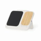 A white stand with a black panel and a bamboo panel, likely for holding devices or accessories.