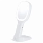White tabletop LED makeup mirror with a stand on a plain background.