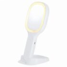 White handheld mirror with a built-in LED light, standing on a matching base.