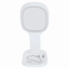 A white vanity mirror with a necklace and earring on its base tray.