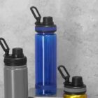 Three reusable water bottles: blue, gray, and yellow, against a light gray background.