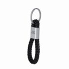 Black braided keychain with a silver metal ring and a HORSE logo engraved on the metal.