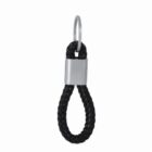 Black braided leather keychain with a metal ring and clasp, looped at the end.
