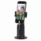 Phone mount holding a smartphone displaying a selfie of two people outdoors.