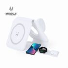 White 3-in-1 wireless charger with phone, smartwatch, and earbuds placed on charging pads.