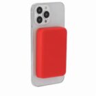 A smartphone with a large red rectangular attachment on its back.