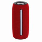 Red portable wireless speaker with a vertical black and white strip on the front.