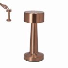 A metallic, cone-shaped table lamp with a cylindrical top in a copper finish.