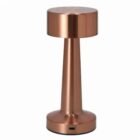 A modern, metallic copper table lamp with a cylindrical base and a round top.