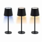 Three black table lamps with shades, each emitting different colored light: blue, white, and yellow.