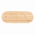 Oval-shaped bamboo charging pad with subtle icons on its surface.