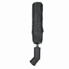 A closed black umbrella with a handle shaped like a boot.
