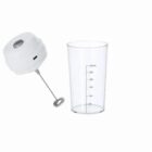 Handheld milk frother and a clear measuring cup marked up to 300 mL on a white background.