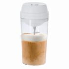 Transparent cup with white lid, filled with coffee and a layer of foam, marked up to 300mL.