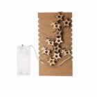 Cardboard wrapped with string lights and star-shaped decorations, battery pack attached.