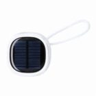 Small square solar panel keychain with a white border and carrying loop.