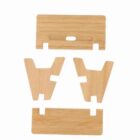Four flat wooden pieces with slots, designed to be assembled into a stand or holder.