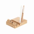 Wooden desk organizer with a calendar, sticky notes, and two pens.