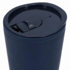 A navy blue travel mug with a closed, flip-top lid.