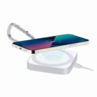Phone wirelessly charging on a connected charging pad with a circular light effect.