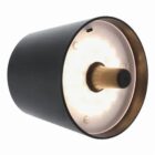 A black and gold wall light with a cylindrical shape.