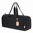 Black duffel bag with two long handles and a tag.